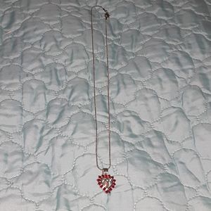 Necklace with a pearl in it.